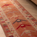 Handmade 2.5x13.4 ft wool and cotton runner rug in brown and beige with a maximalist Persian-style geometric floral pattern.