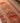 Handmade 2.5x13.4 ft wool and cotton runner rug in brown and beige with a maximalist Persian-style geometric floral pattern.