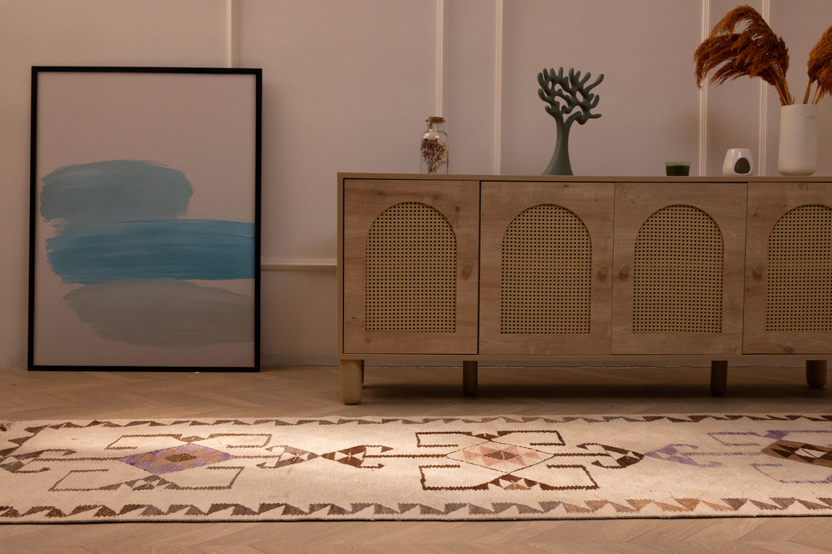 Handmade 3x11 ft white and brown wool-cotton Kilim runner with geometric patterns in a farmhouse interior.