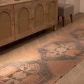 Hand-woven vintage Turkish runner rug in orange and gray geometric wool, 2x11 ft, styled in a farmhouse interior.