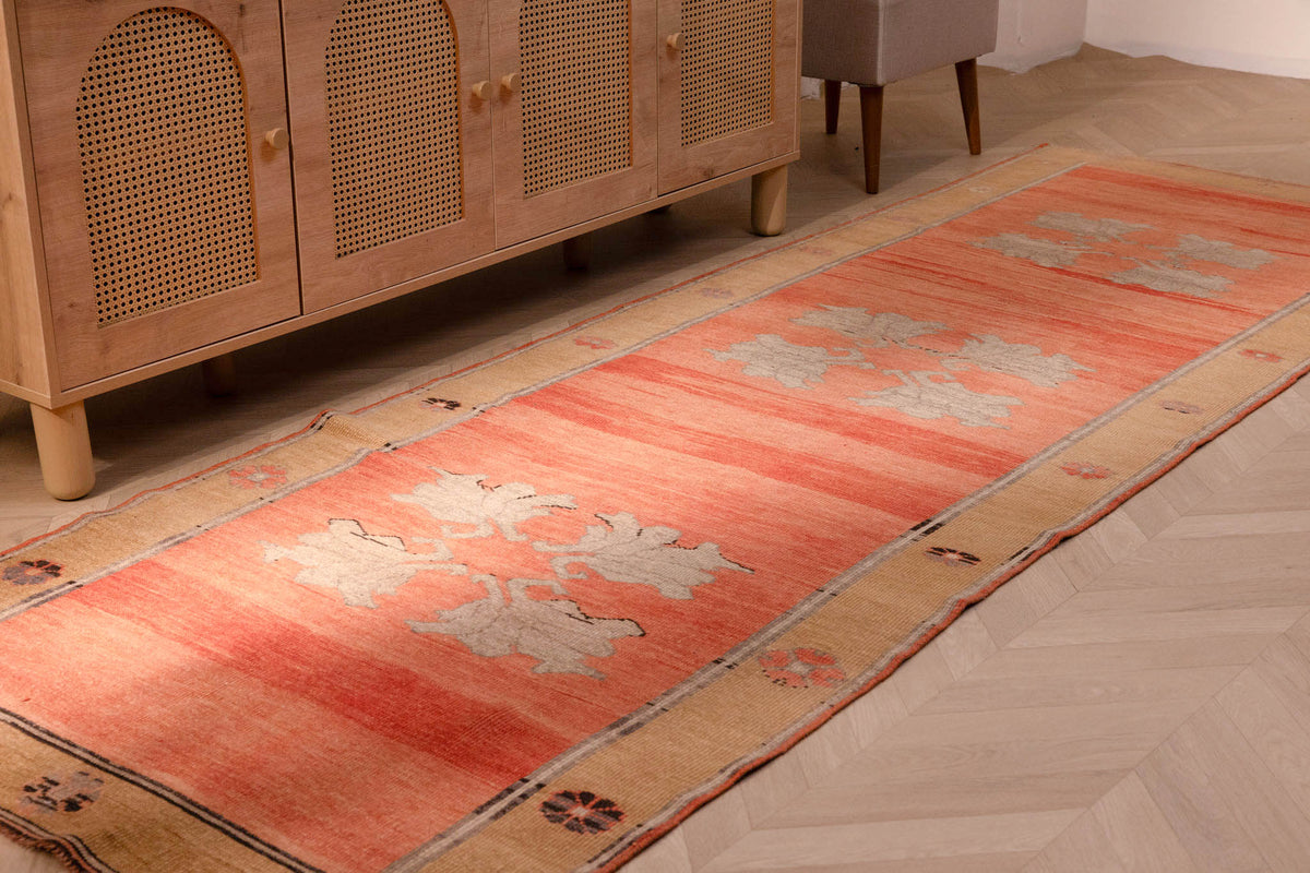 Vintage 3.7x10.9 ft handmade Sivas wool runner rug in burnt orange with floral patterns and minimalist brown accents.