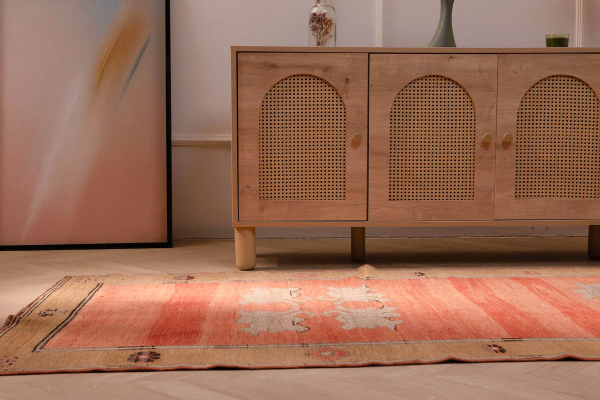 Hand-woven orange vintage Sivas Turkish wool runner rug with floral patterns in a farmhouse interior setting.