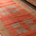 Hand-woven vintage Sivas Turkish wool runner rug in burnt orange with brown floral motifs and minimalist geometric patterns.