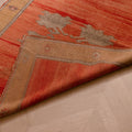Hand-woven vintage Sivas wool runner rug in burnt orange and brown with floral motifs and a folded corner.