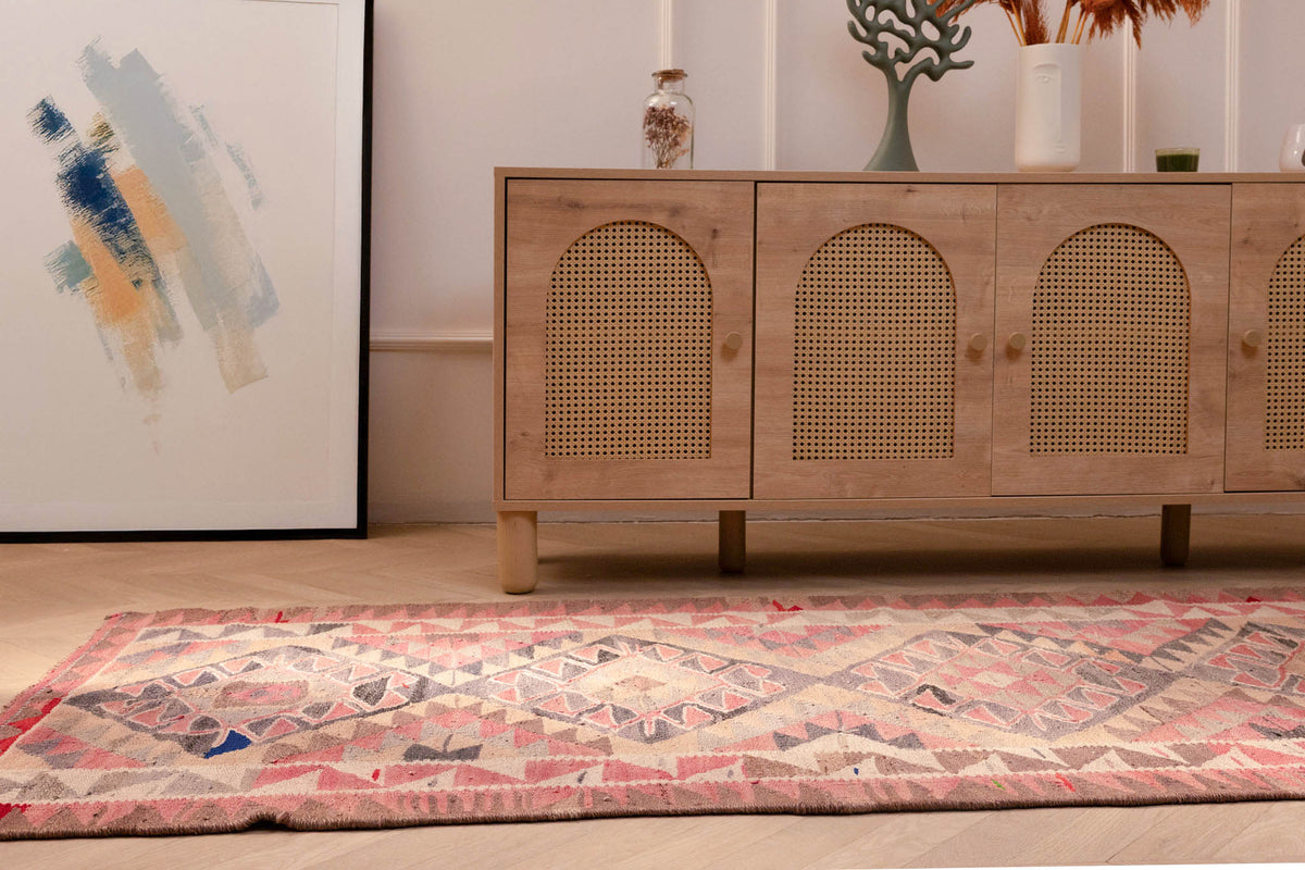 Handmade pink and gray Persian-style wool-cotton Kilim runner with geometric bohemian patterns.