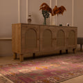 Hand-woven vintage Turkish runner rug in pink and brown with geometric patterns, 3x10 ft wool and cotton blend.