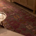 Hand-woven vintage Turkish runner rug in pink and brown with geometric patterns, 3x10 ft wool and cotton blend.