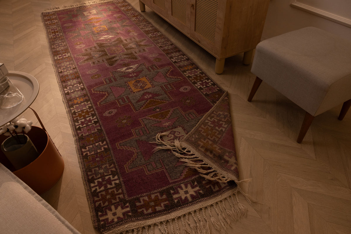 Handmade vintage Turkish runner rug in pink and brown with geometric patterns, crafted from wool and cotton, 3x10 ft.