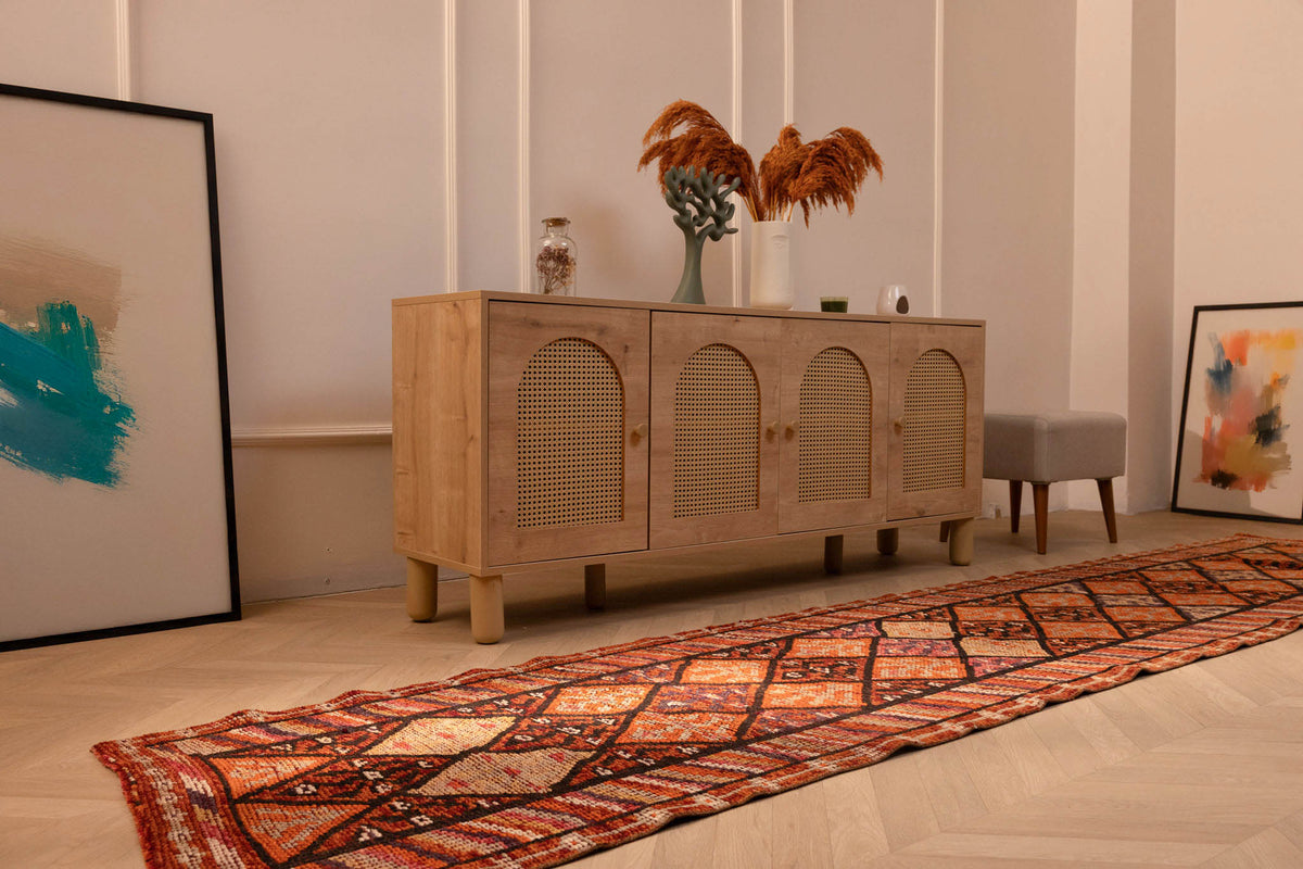 Handmade 2.7x13.3 ft wool and cotton runner rug featuring a bohemian geometric pattern in brown and orange tones.