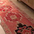 Handmade pink wool and cotton Persian-style runner rug with geometric bohemian patterns, 2.9 x 11.1 ft.