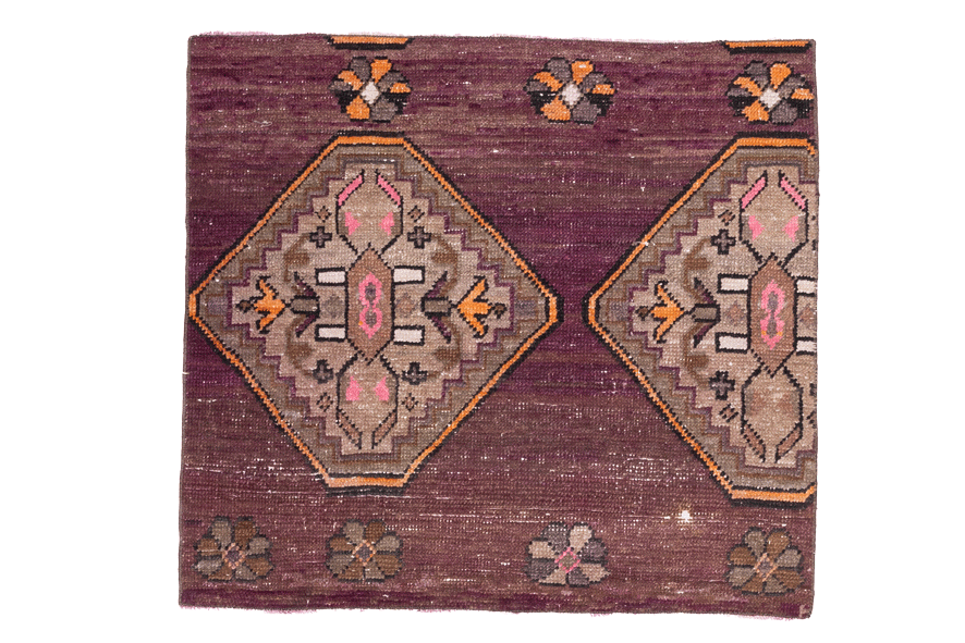 Decorative rug with geometric pattern on a white background
