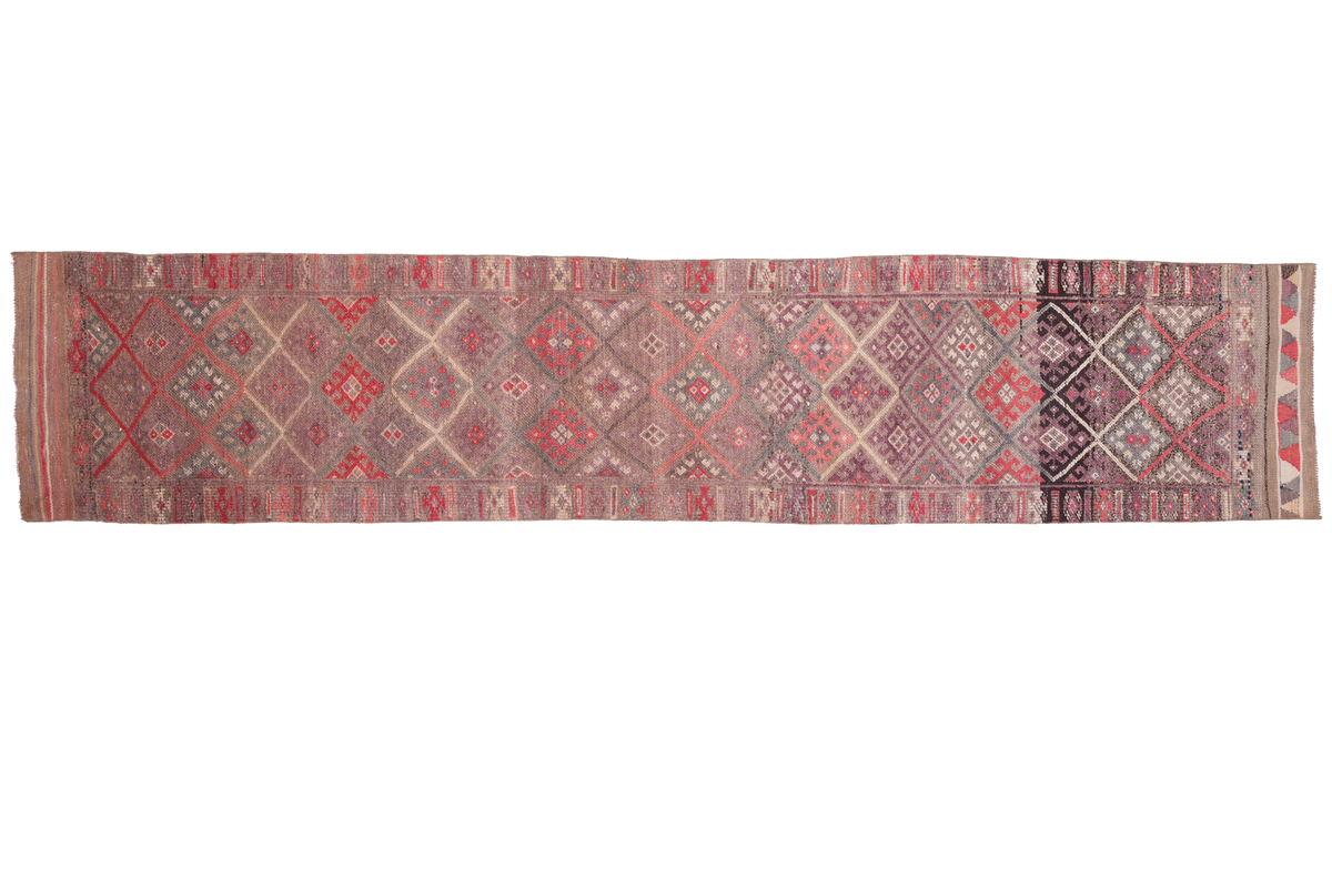 Woven textile with geometric pattern on a white background