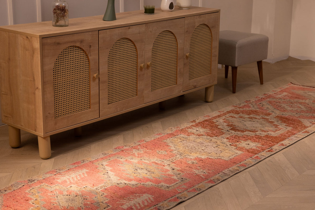 Handmade 2.6x12.4 ft Persian-style runner rug in pink and brown wool-cotton blend with geometric bohemian patterns.
