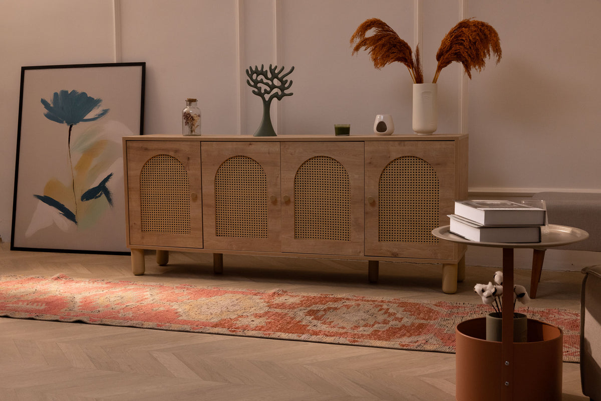 Pink and brown Persian-style wool and cotton runner rug with geometric patterns in a bohemian living room.