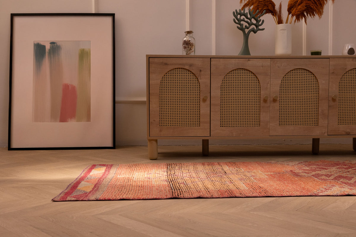 Handmade 2.9x9.9 ft wool and cotton Persian runner rug featuring orange floral patterns in a bohemian style.