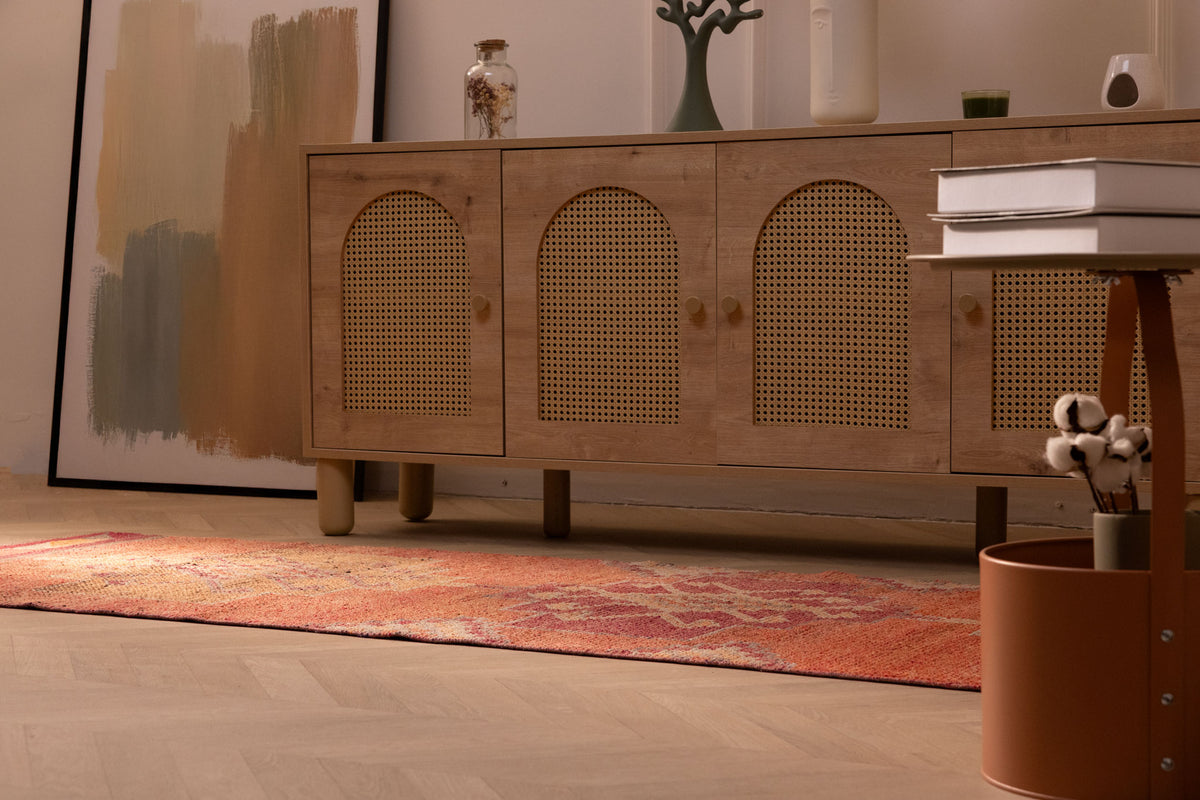Handmade orange Persian-style runner rug with floral patterns, crafted from wool and cotton in a bohemian design.