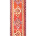 Handmade 3x11 ft Persian-style wool and cotton Kilim runner with red and orange geometric patterns.
