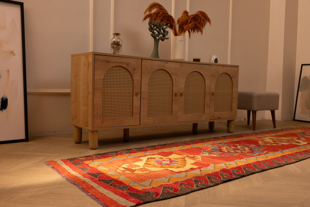 Handmade 3.2x11.2 ft Persian-style Kilim runner rug in red and orange with geometric patterns, crafted from wool and cotton.