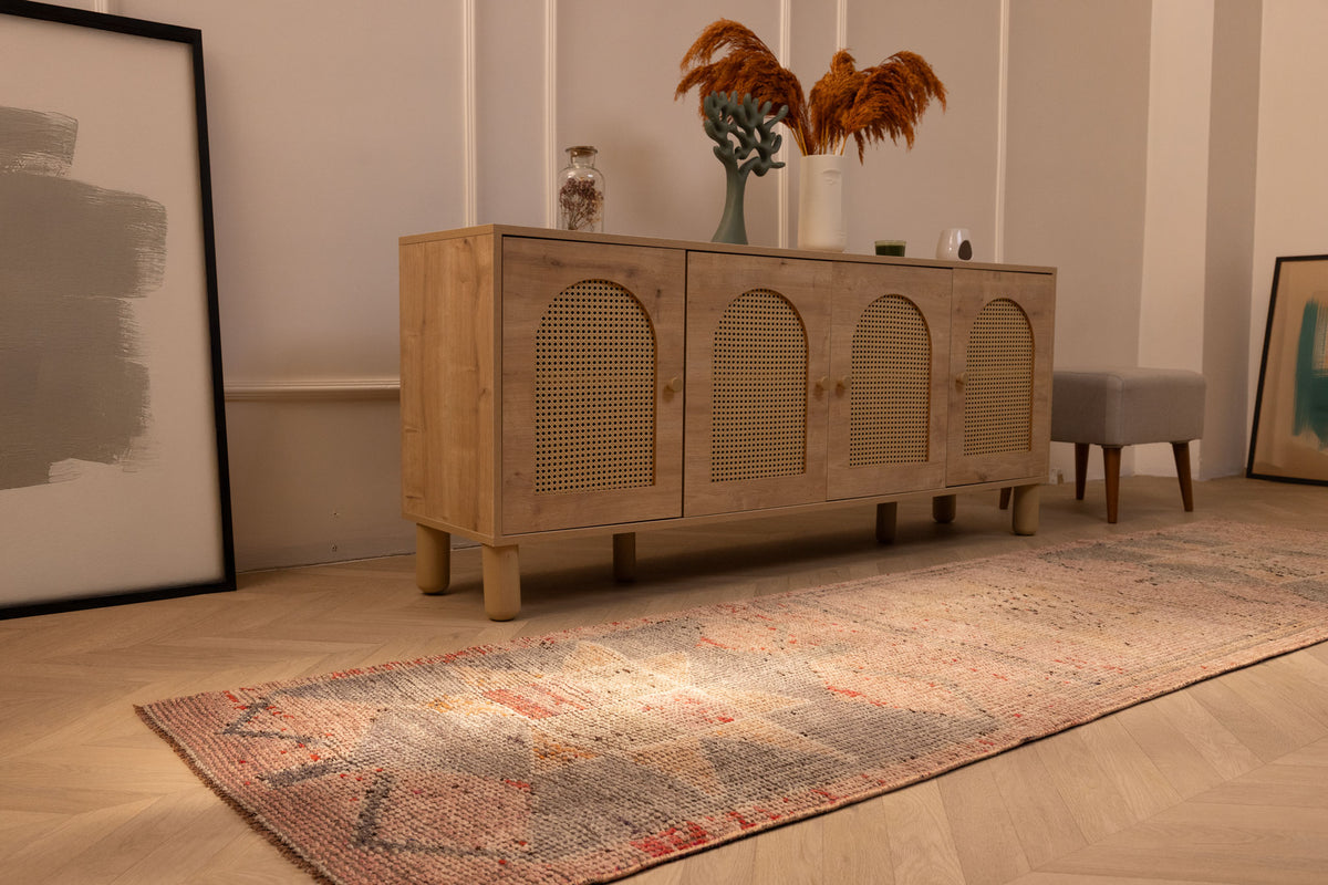 Handmade 2.9x10.2 ft wool and cotton Persian-style runner rug in pink and brown with geometric patterns.
