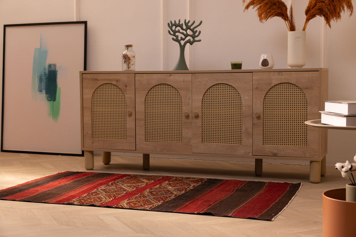 Handmade 3x5 ft vintage Turkish wool kilim rug in red and brown with geometric patterns on a light wood floor.