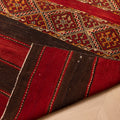 Hand-woven 3x5 ft Turkish wool kilim rug featuring red and brown geometric patterns and a rustic flatweave design.