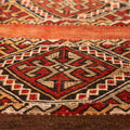 Hand-woven vintage Turkish wool rug with red and brown geometric patterns in a 3x4 ft flatweave design.