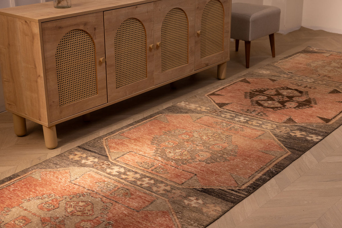 Handwoven vintage Turkish runner rug in orange and brown with geometric patterns, 3x13 ft wool and cotton blend.