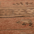 Handwoven vintage Turkish runner rug in orange and brown with geometric wool and cotton patterns.