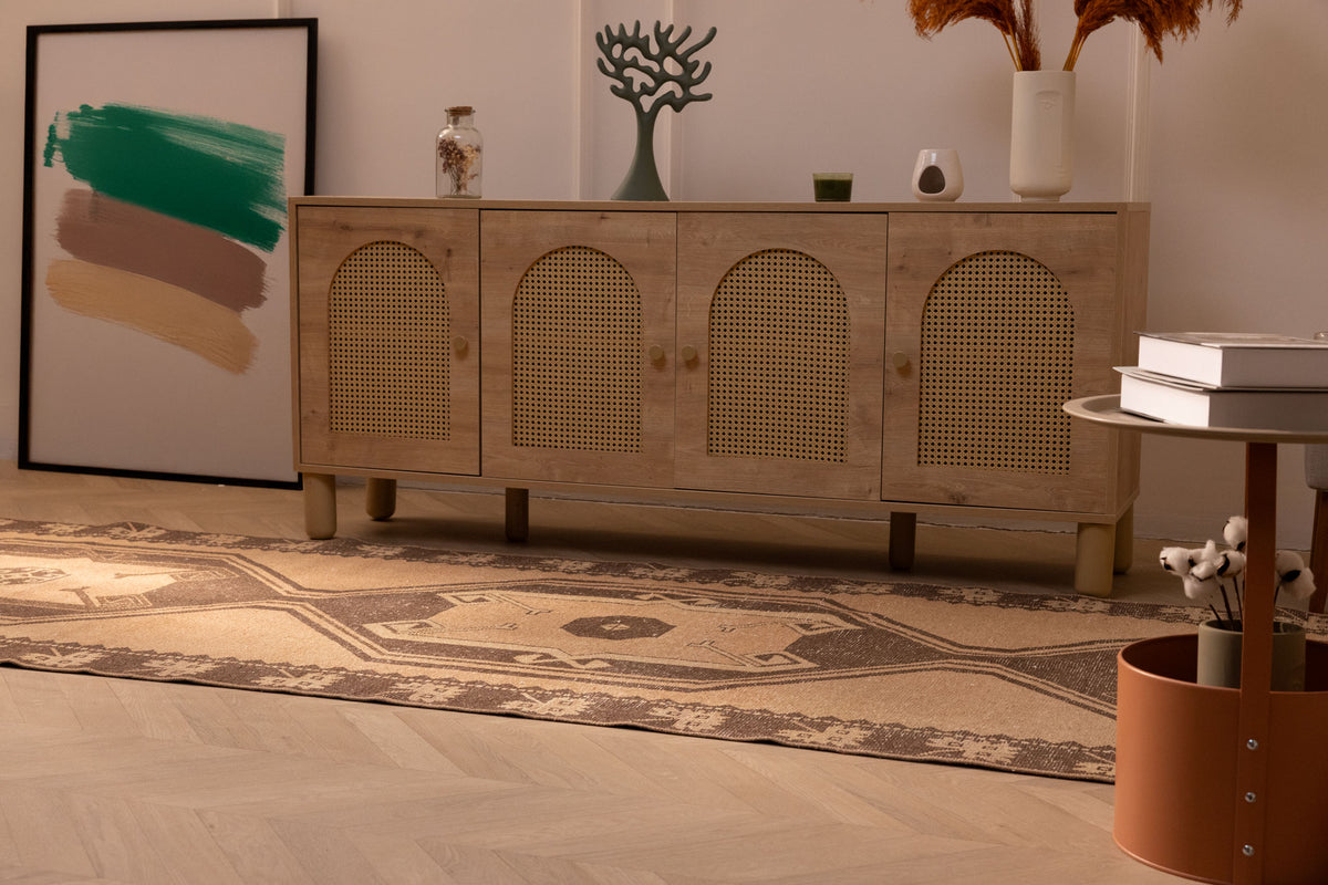 Handwoven 4x14 ft vintage Turkish runner rug in orange and gray with geometric patterns on a herringbone floor.