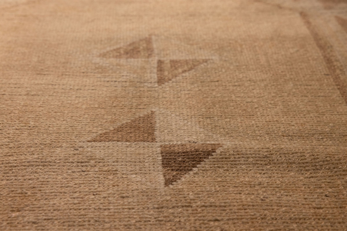 Handwoven vintage Turkish runner rug in brown and beige with geometric patterns and a textured wool-cotton blend.