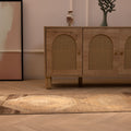 Vintage 2x9 ft Turkish runner rug in beige and brown wool with geometric patterns on a herringbone wood floor.
