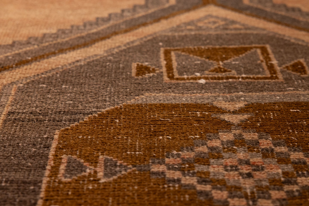 Handwoven vintage Malatya Turkish runner rug in orange and gray with geometric wool patterns.
