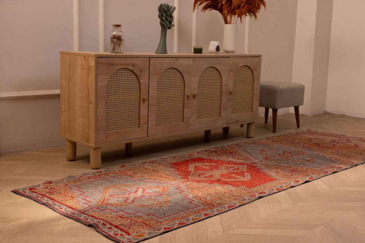Handmade 3.4x10.3 ft Persian style runner rug in orange and brown wool-cotton blend with geometric bohemian patterns.