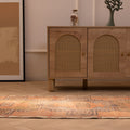 Vintage 2x11 ft Turkish runner rug in brown and orange with geometric patterns, handwoven from wool and cotton.