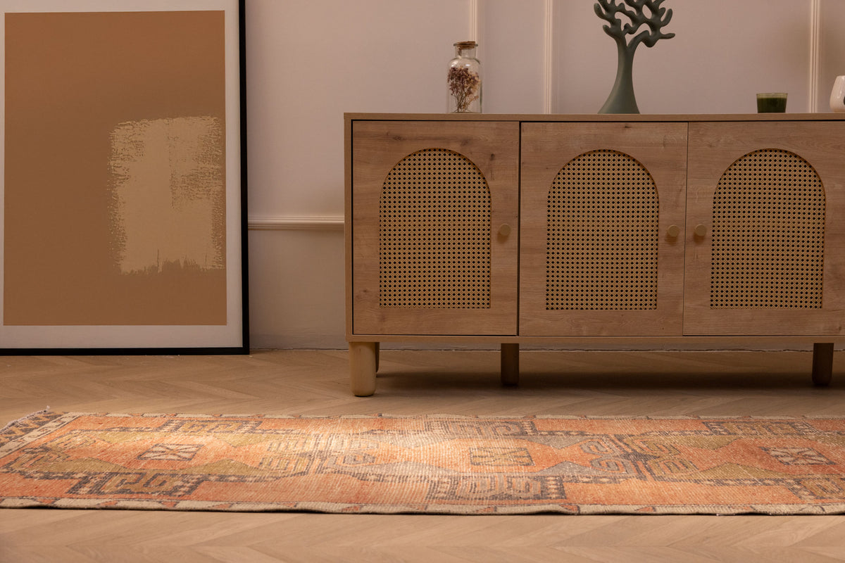Vintage 2x11 ft Turkish runner rug in brown and orange with geometric patterns, handwoven from wool and cotton.