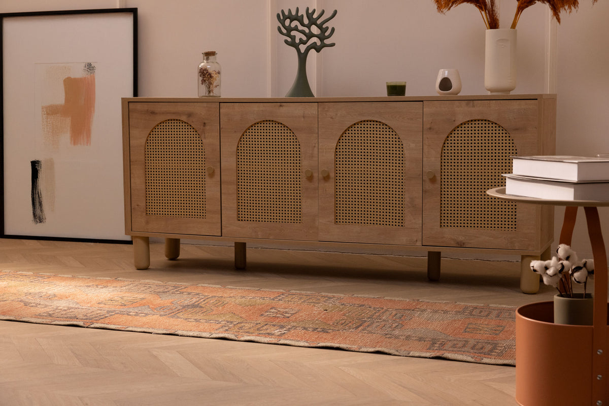 Vintage Malatya Turkish runner rug in brown and orange with geometric patterns on a wooden floor.