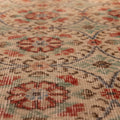 Vintage handmade wool and cotton Isparta runner rug with beige and green floral patterns.