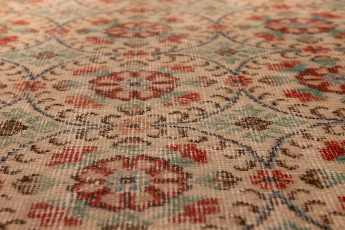 Vintage handmade wool and cotton Isparta runner rug with beige and green floral patterns.