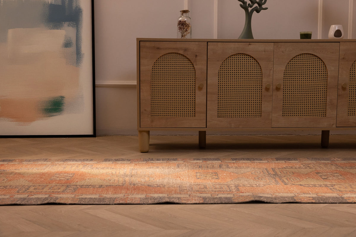 Vintage Turkish runner rug in orange and gray wool with geometric patterns, 3x11 ft, displayed in a modern farmhouse interior.