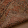Hand-woven 3x11 ft vintage Turkish runner rug in orange and gray wool with geometric tribal patterns.