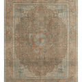 Oversized 9.7x12.5 ft wool and cotton Persian-style rug in brown and orange with intricate floral maximalist patterns.