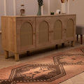Vintage 3x11 ft Turkish runner rug in brown and orange wool with geometric tribal patterns on a wooden floor.