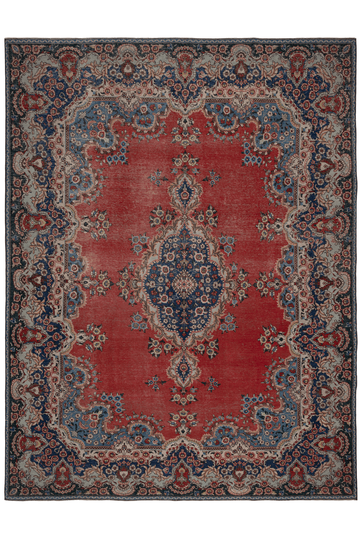 Oversized red and navy Persian-style wool and cotton area rug featuring intricate floral patterns and traditional motifs.