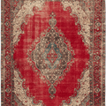Oversized 9x11ft handmade wool and cotton Persian rug featuring a red floral pattern with traditional bohemian motifs.