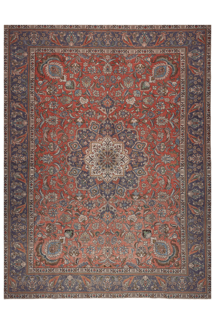 Oversized 9.7x13 ft handmade wool and cotton Persian-style rug featuring red and navy floral patterns.