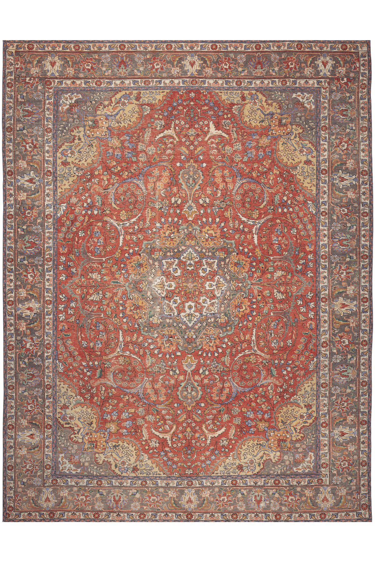 Oversized red Persian-style area rug in wool and cotton with intricate floral motifs and traditional bohemian patterns.