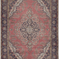 Oversized pink Persian-style wool and cotton area rug featuring intricate floral motifs and traditional bohemian patterns.