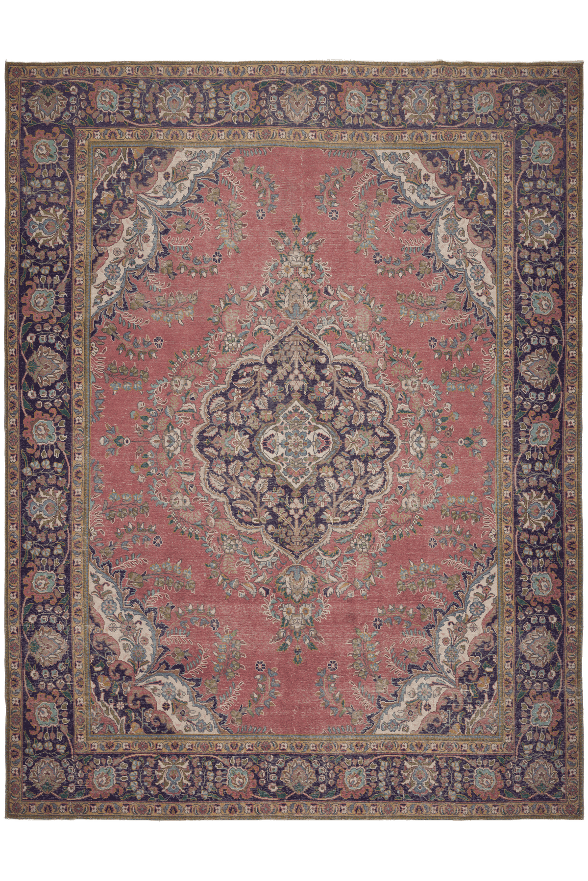 Oversized pink Persian-style wool and cotton area rug featuring intricate floral motifs and traditional bohemian patterns.