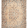 Oversized beige Persian-style wool and cotton rug featuring intricate floral motifs and traditional bohemian patterns.