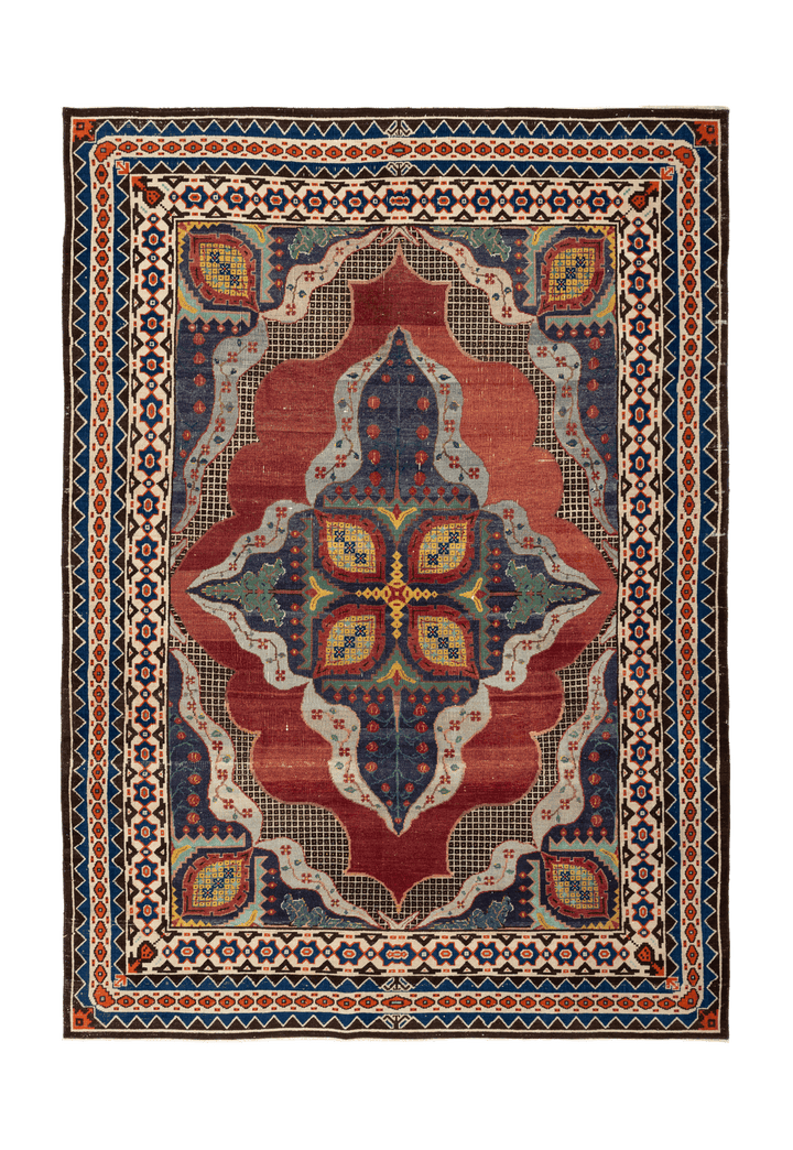 Handmade 7x10 ft Persian-style wool and cotton area rug featuring a red and navy floral maximalist pattern.